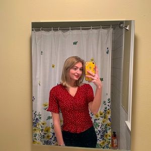 red polka dot shirt